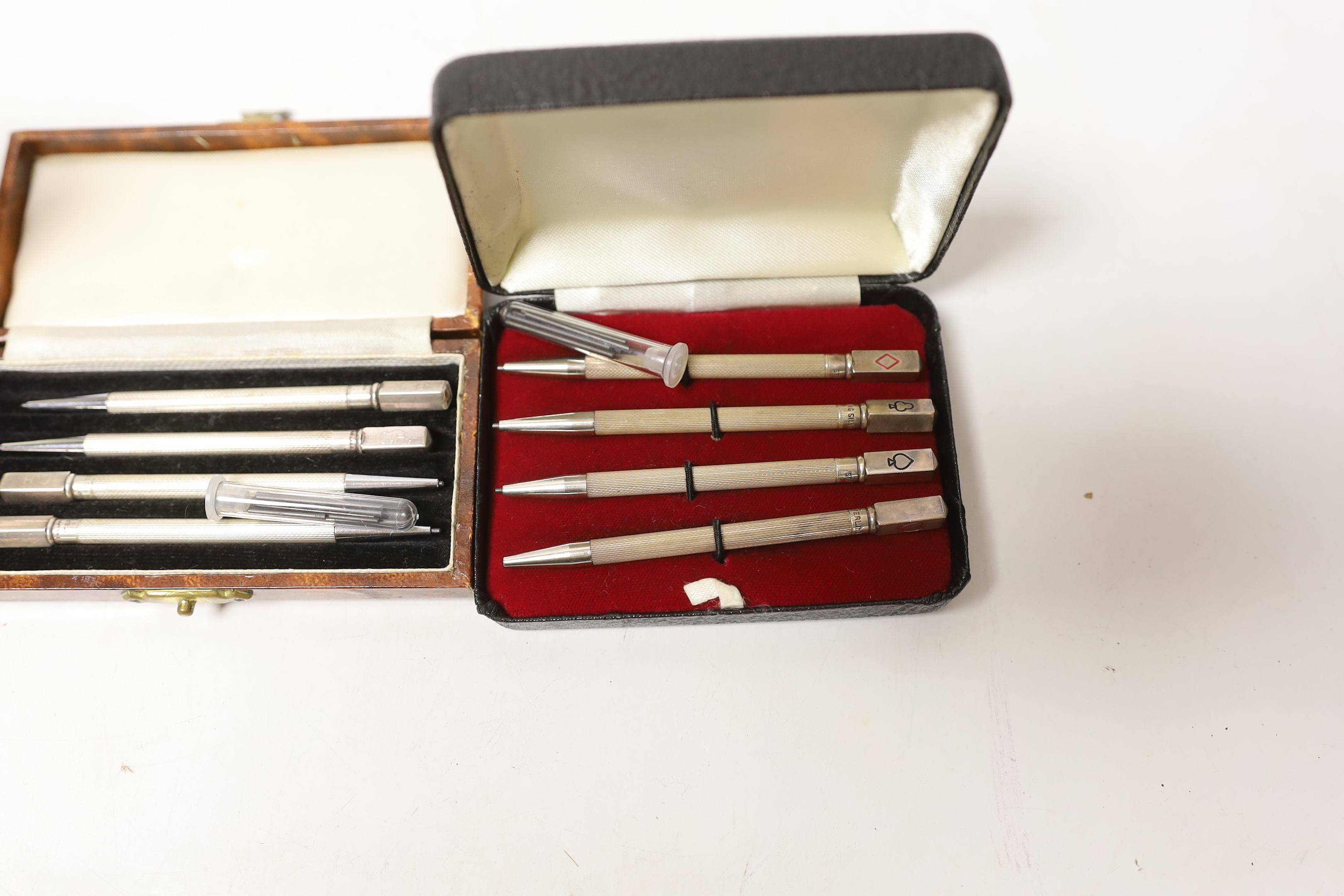 Three cased sets of sterling bridge pencils and a modern silver bookmark.